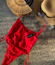 Load image into Gallery viewer, Highway One Piece in red on a waterfall back ground 
