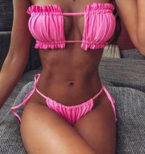 Load image into Gallery viewer, A women sitting down wearing the pink  Shelby Bikini 
