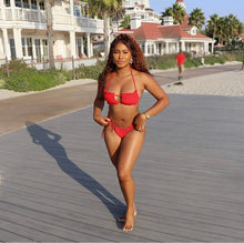 Load image into Gallery viewer, A women wearing the red Shelby bikini 

