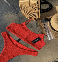 Load image into Gallery viewer, Red Ruffel bikini on a waterfall back ground, styled with the hand made Tammy bamboo bag
