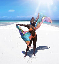 Load image into Gallery viewer, Ibiza Bikini swimsuit on a model on a white sand beach 
